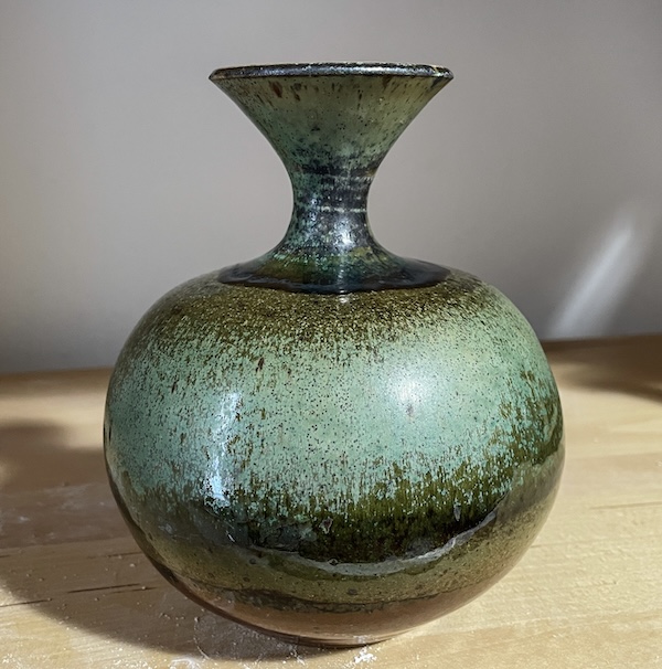 Wheel-thrown ceramic vase with mottled green glaze made by Lisette Bedoya at A Maker's Circle, Pottersville NJ
