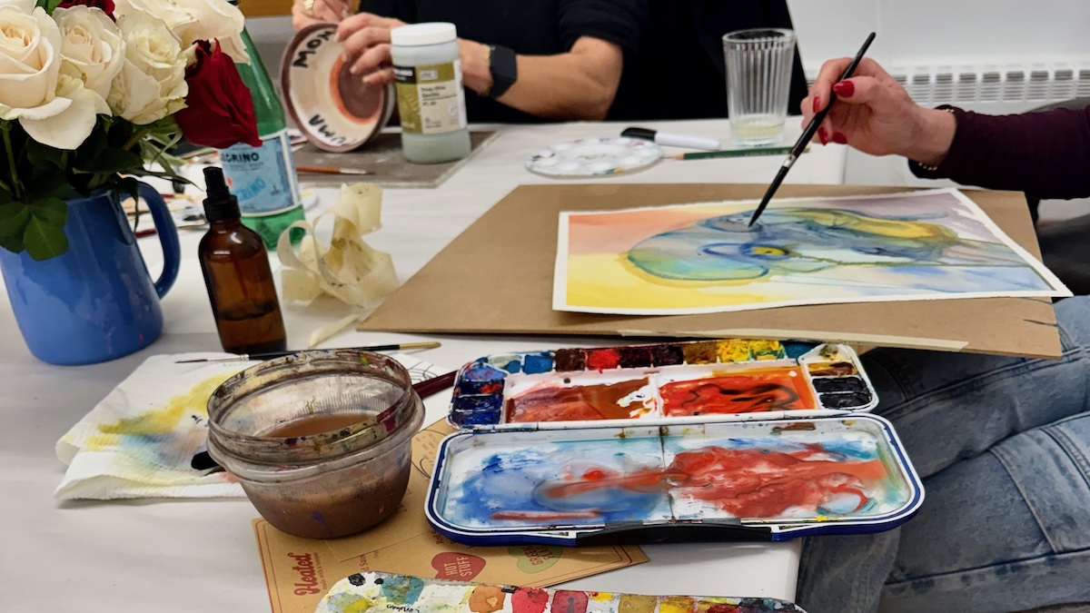 Art Bar attendee paints a watercolor portrait at Art Bar event at A Maker's Circle art studio in Pottersville NJ
