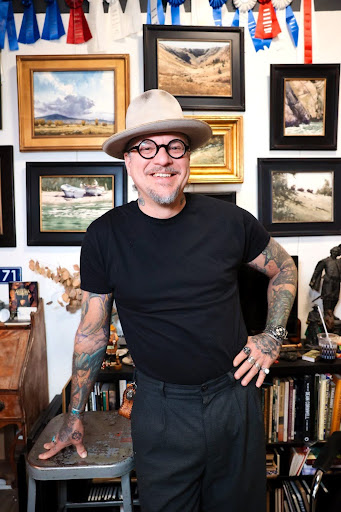 Dan Marshall, guest watercolor workshop instructor at A Maker's Circle in Pottersville NJ, smiling in his art studio surrounded by award-winning paintings